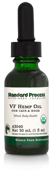 Image of a bottle of liquid VF Hemp Oil from Standard Process Veterinary Formulas next to a dropper that is included with the bottle.